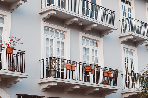 a close up of an apartment complex balcony